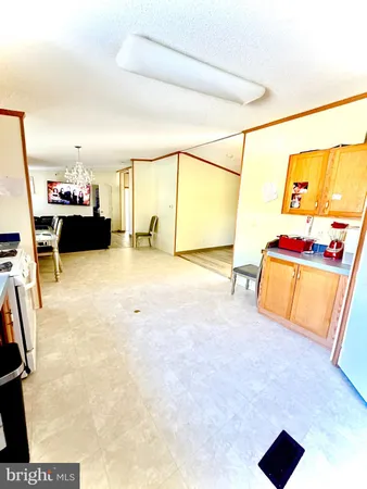 a kitchen with stainless steel appliances granite countertop a stove and a sink