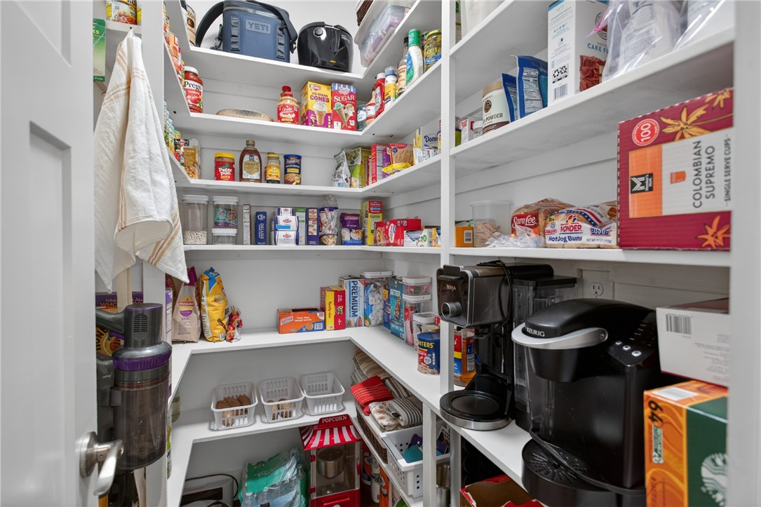 2024 Retreat Pointe Road West Union, SC 29696 - Photo 16 of 43 A well-organized pantry features expansive shelving, offering generous storage for culinary essentials.