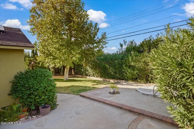 a view of a yard with an outdoor space