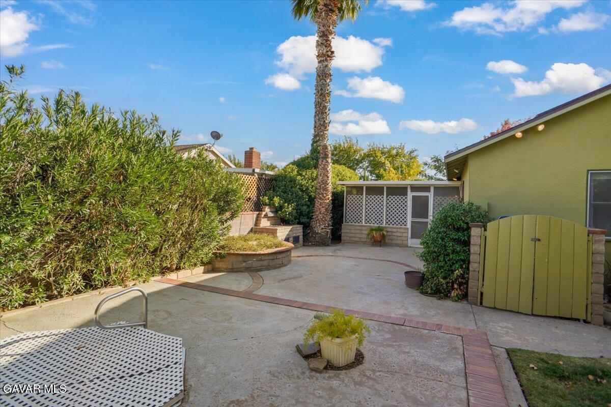 719 West Ave J-10 Lancaster, CA 93534 - Photo 18 of 21 a view of a house with sitting area and garden