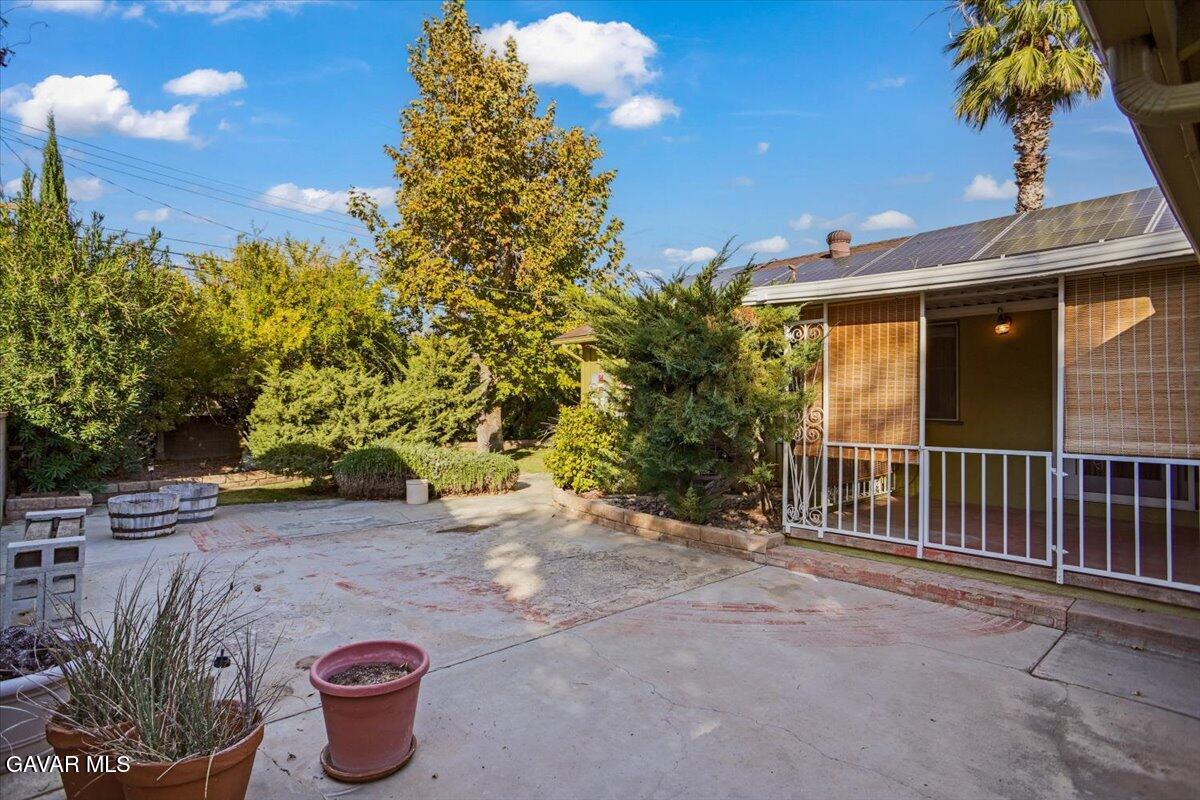 719 West Ave J-10 Lancaster, CA 93534 - Photo 19 of 21 a view of a backyard with plants and trees