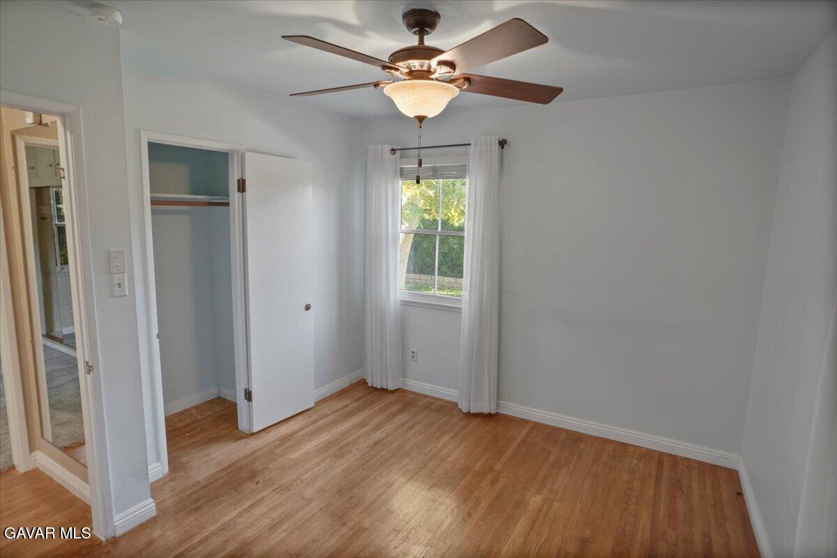 719 West Ave J-10 Lancaster, CA 93534 - Photo 8 of 21 a view of an empty room with window chandelier fan