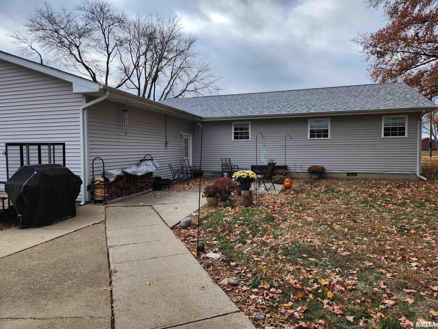 15766 East Tilton Road Ina, IL 62846 - Photo 51 of 59 a backyard of a house with table and chairs