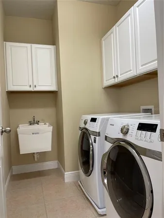 a utility room with dryer and washer