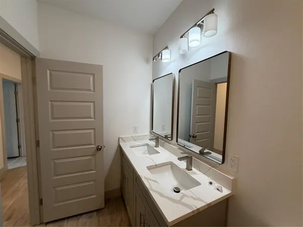 a bathroom with a sink vanity and a mirror