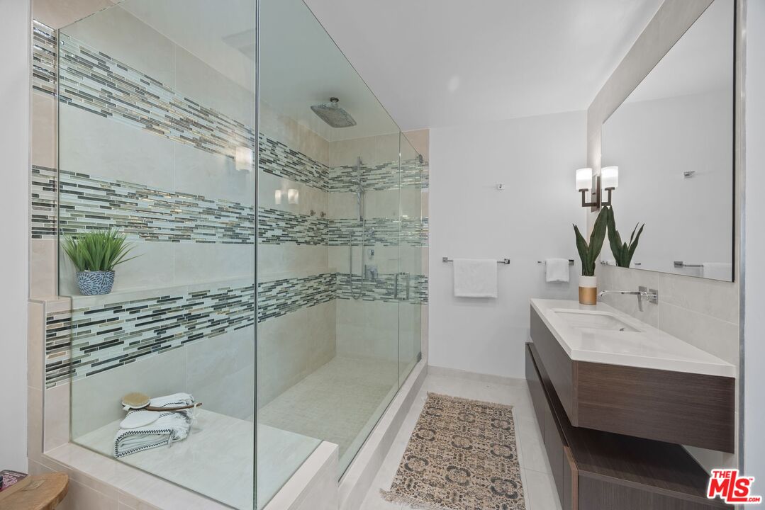 13065 Mindanao Way, Unit 3 Marina del Rey, CA 90292 - Photo 16 of 25 a bathroom with a double vanity sink and mirror