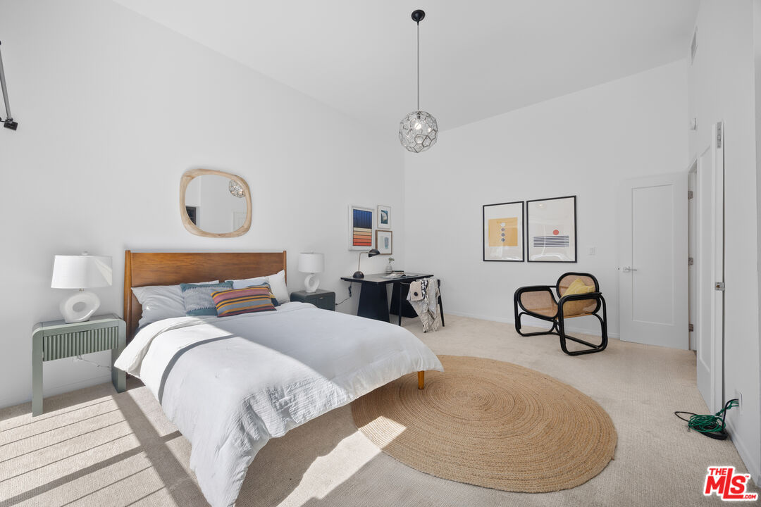 13065 Mindanao Way, Unit 3 Marina del Rey, CA 90292 - Photo 18 of 25 a bedroom with bed and window