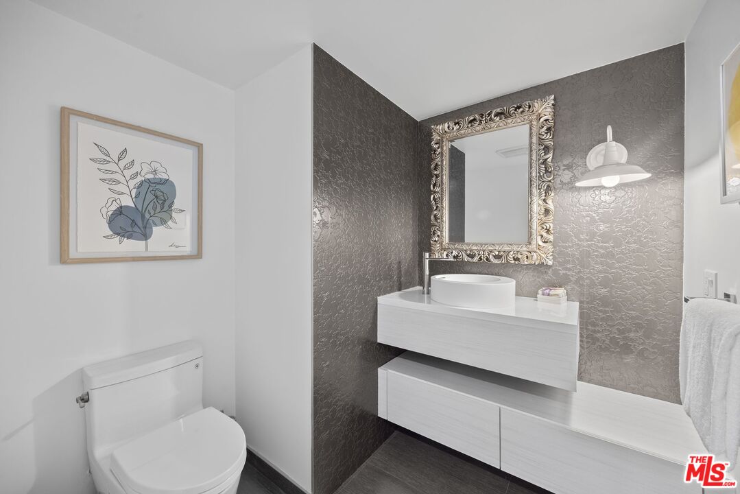 13065 Mindanao Way, Unit 3 Marina del Rey, CA 90292 - Photo 20 of 25 a bathroom with a toilet sink and mirror
