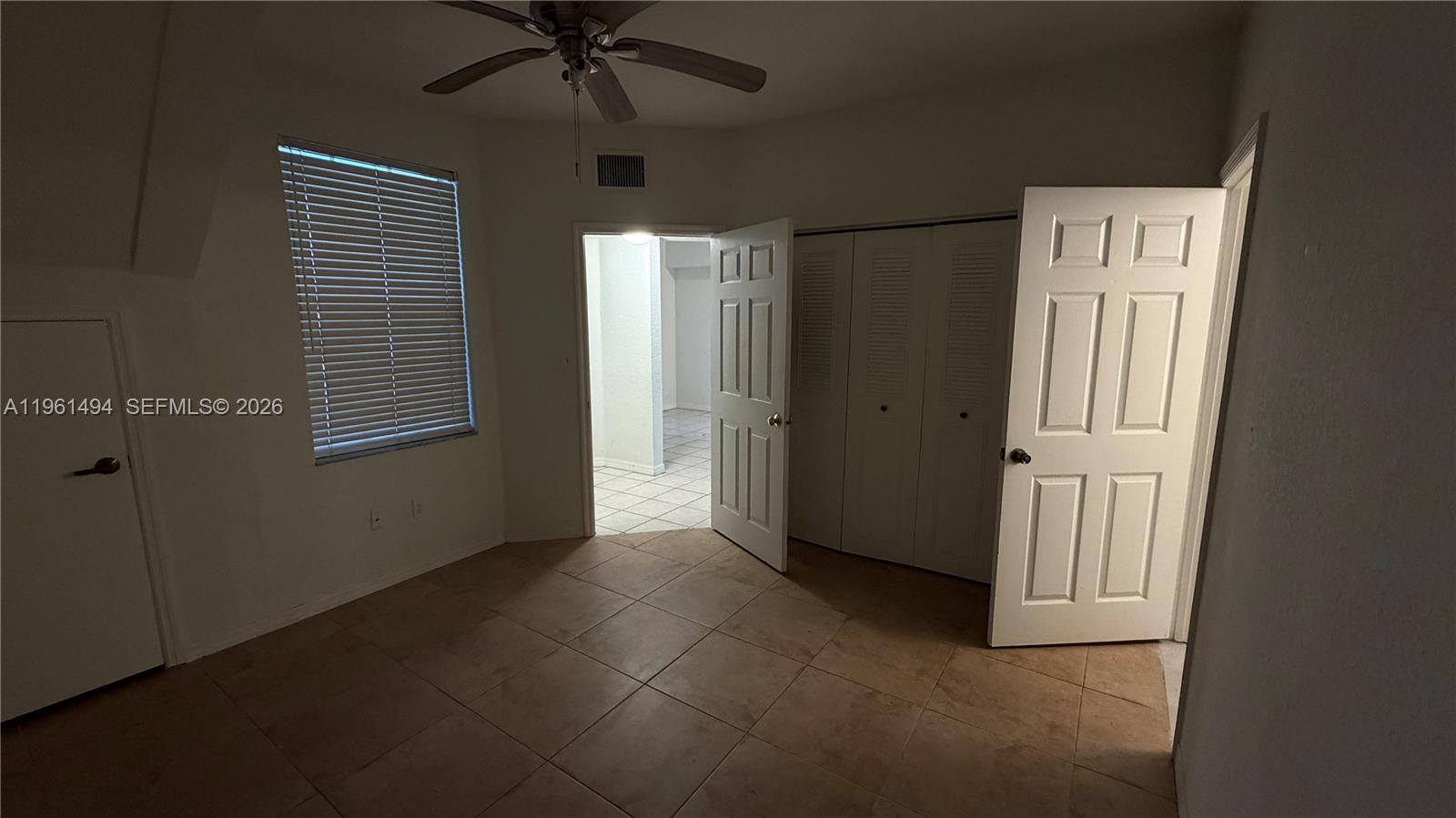 741 Southwest 148th Avenue, Unit 705 Sunrise, FL 33325 - Photo 23 of 32 an empty room with windows and entryway