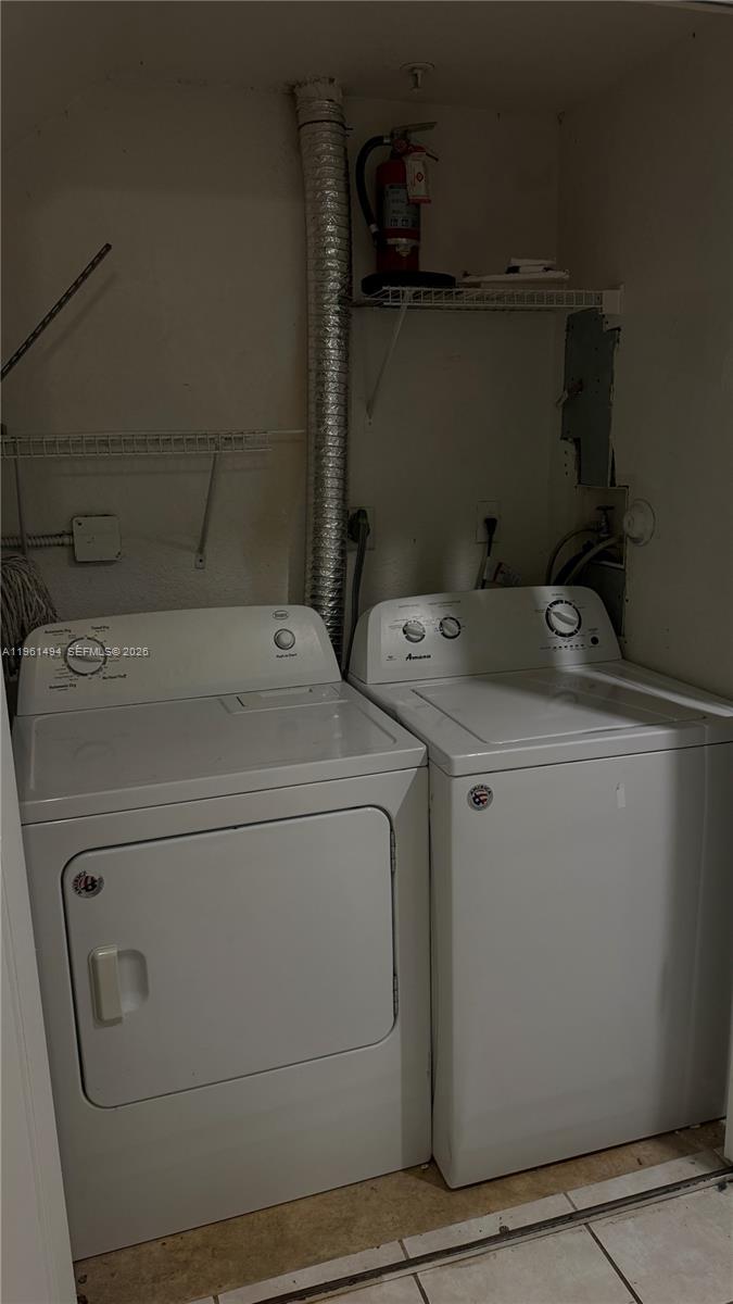 741 Southwest 148th Avenue, Unit 705 Sunrise, FL 33325 - Photo 29 of 32 a utility room with dryer and washer