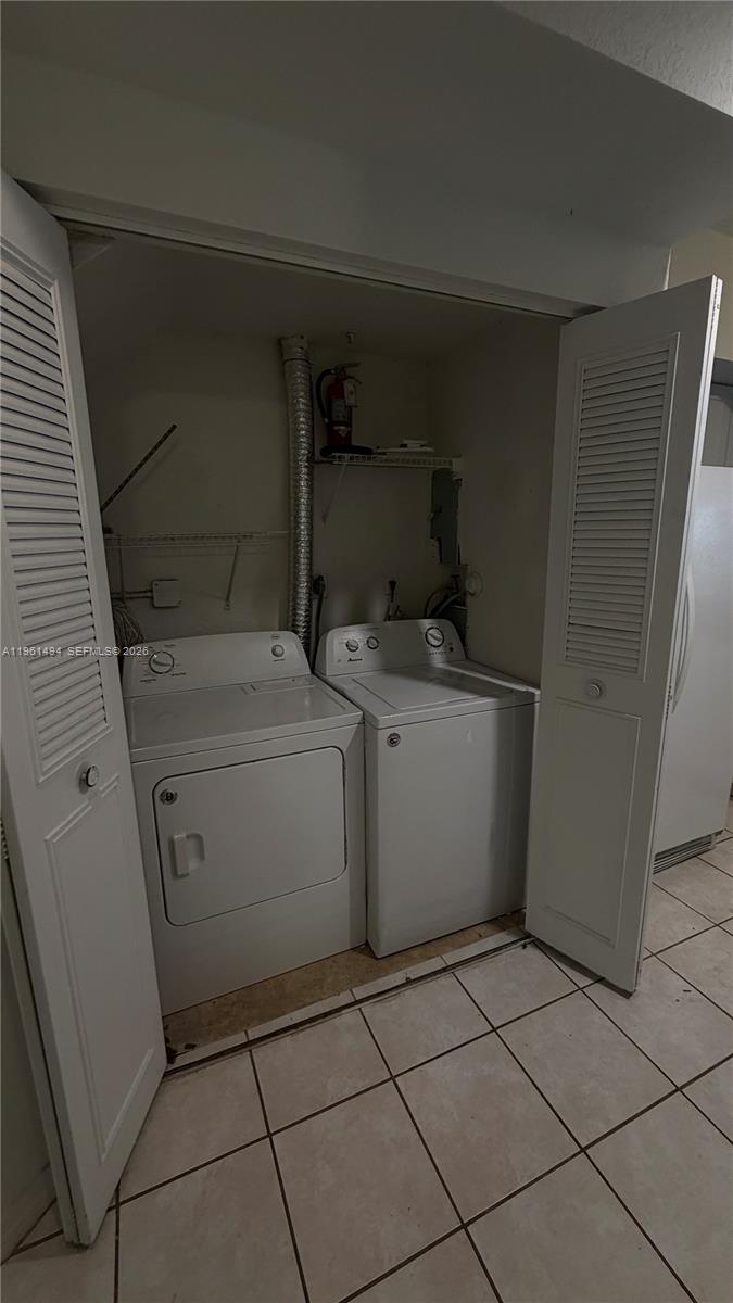 741 Southwest 148th Avenue, Unit 705 Sunrise, FL 33325 - Photo 30 of 32 a utility room with dryer and washer