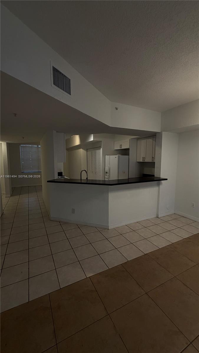 741 Southwest 148th Avenue, Unit 705 Sunrise, FL 33325 - Photo 9 of 32 a view of a hallway