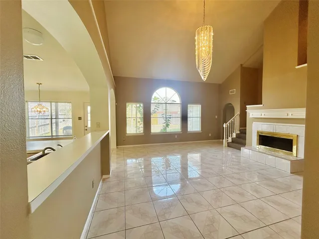 a large spacious bathroom with a large mirror vanity and bathtub