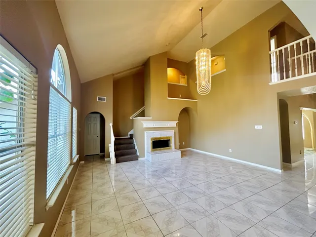 a view of a livingroom with a fireplace and furniture