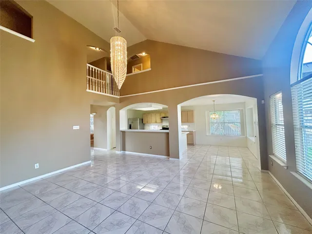 a view of a hallway with a chandelier