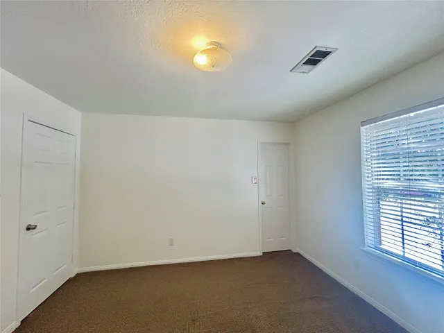 an empty room with a empty space and window