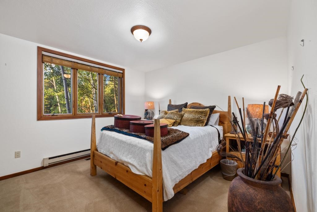 82 Lenawee Lane Keystone, CO 80435 - Photo 16 of 39 a bed room with a bed and a chair