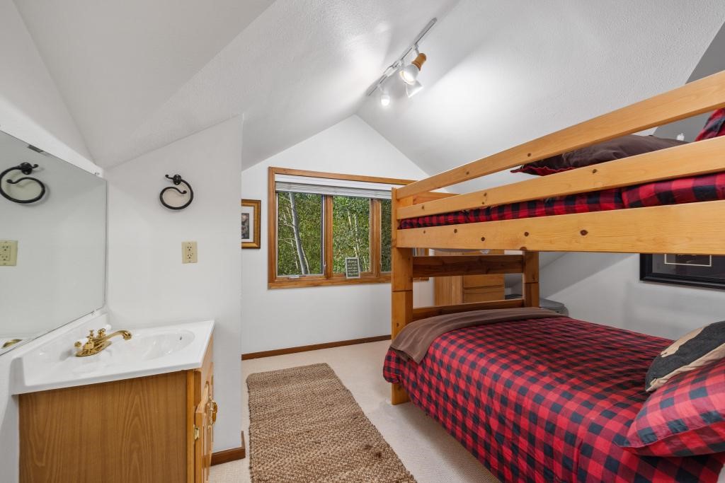 82 Lenawee Lane Keystone, CO 80435 - Photo 18 of 39 a bedroom with a bed and wooden floor