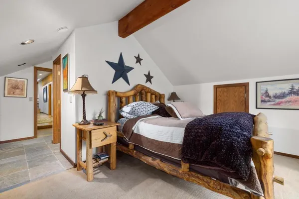 a bedroom with a bed and a cabinets