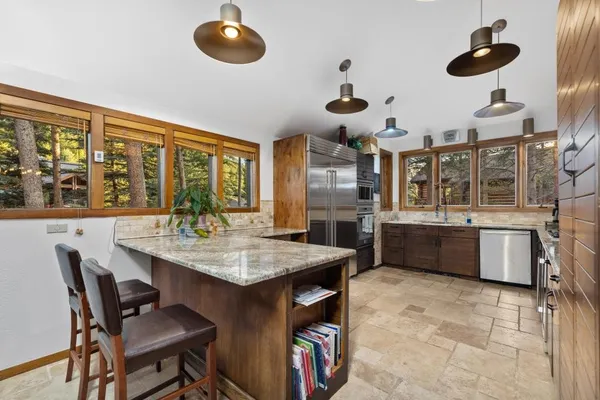 a kitchen with a counter space cabinets and appliances