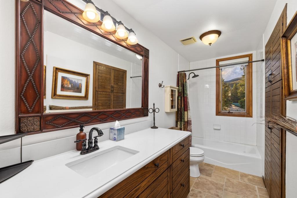 82 Lenawee Lane Keystone, CO 80435 - Photo 21 of 39 a bathroom with a sink tub double vanity and a mirror