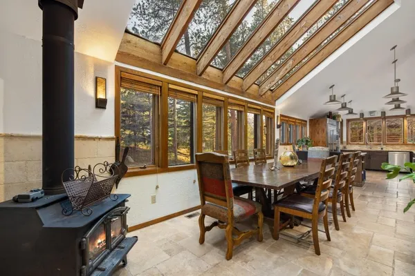 a view of a dining room with furniture window and outside view