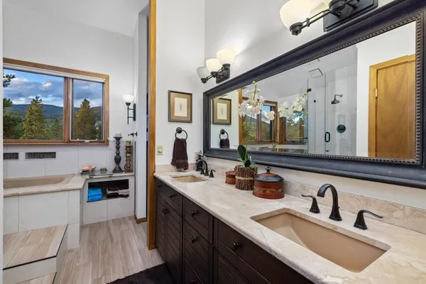 a bathroom with a sink and a large mirror