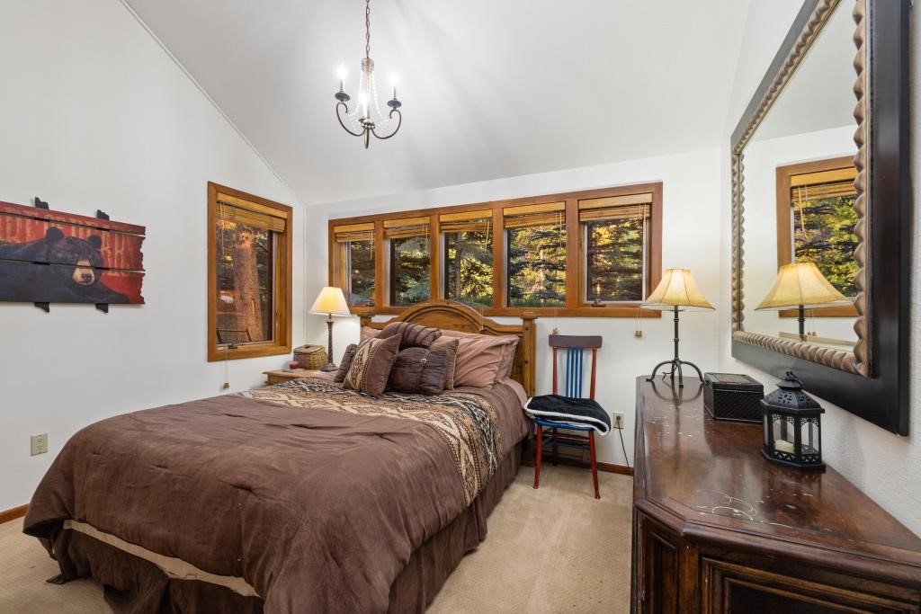 82 Lenawee Lane Keystone, CO 80435 - Photo 8 of 39 a bedroom with a bed and wooden floor