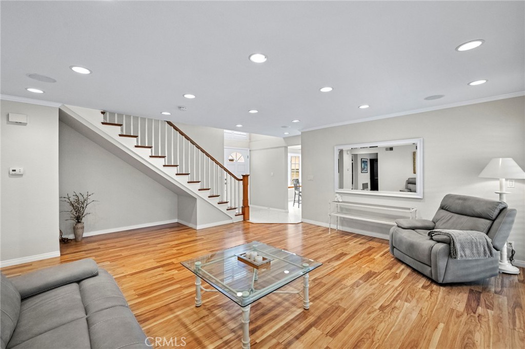 2342 Caper Tree Drive Tustin, CA 92780 - Photo 12 of 44 a living room with furniture and a wooden floor
