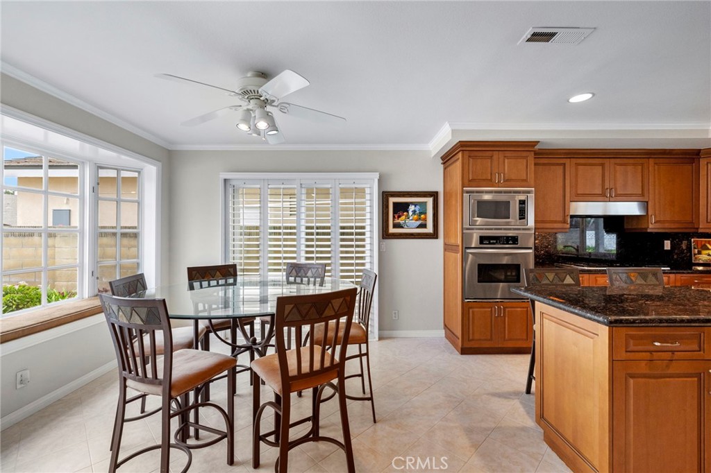 2342 Caper Tree Drive Tustin, CA 92780 - Photo 14 of 44 a view of a dining room with furniture window and outside view