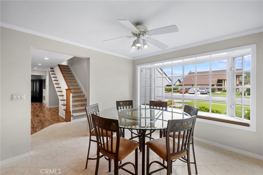 2342 Caper Tree Drive Tustin, CA 92780 - Photo 15 of 44 a view of a dining room with furniture window and wooden floor