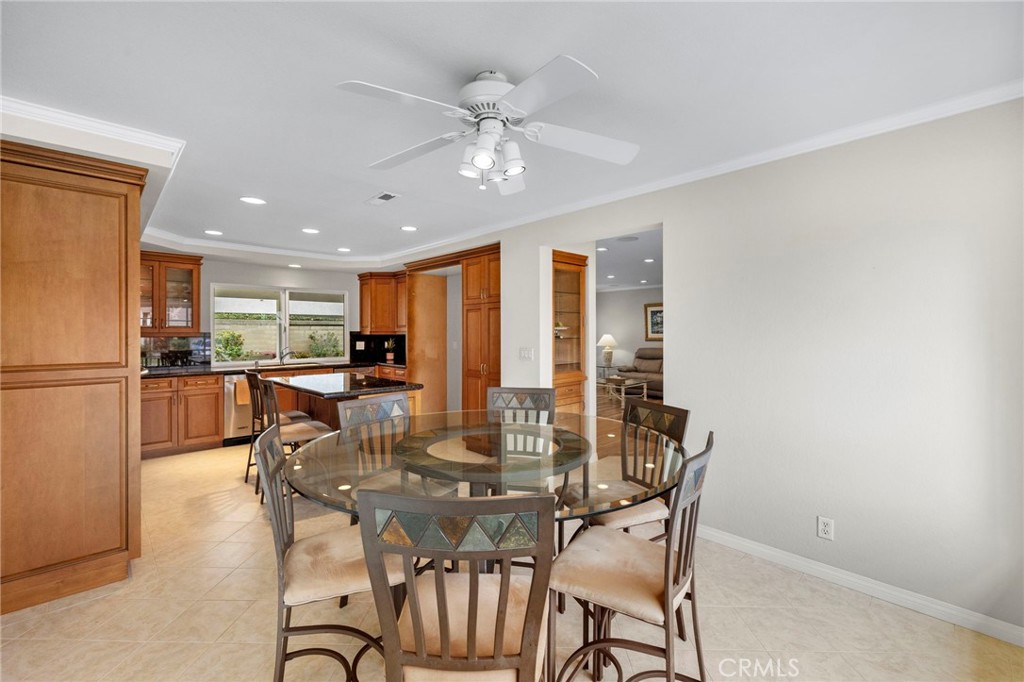 2342 Caper Tree Drive Tustin, CA 92780 - Photo 16 of 44 a view of a dining room with furniture and a chandelier