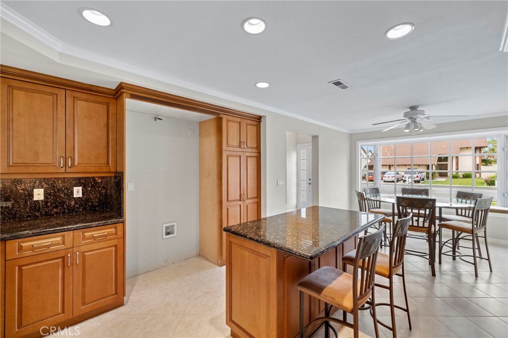 2342 Caper Tree Drive Tustin, CA 92780 - Photo 21 of 44 a view of a kitchen and dining room