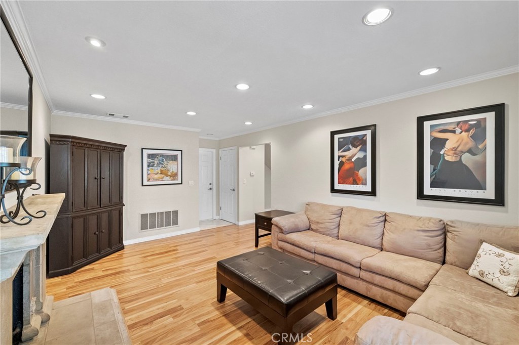 2342 Caper Tree Drive Tustin, CA 92780 - Photo 25 of 44 a living room with furniture and a wooden floor