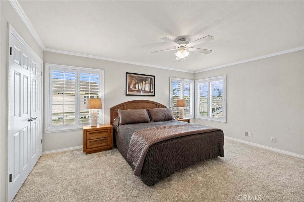 2342 Caper Tree Drive Tustin, CA 92780 - Photo 26 of 44 a spacious bedroom with a bed and a window