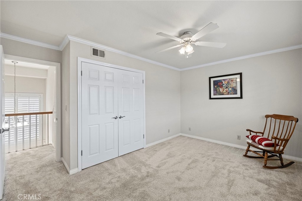 2342 Caper Tree Drive Tustin, CA 92780 - Photo 34 of 44 an empty room with windows and ceiling fan