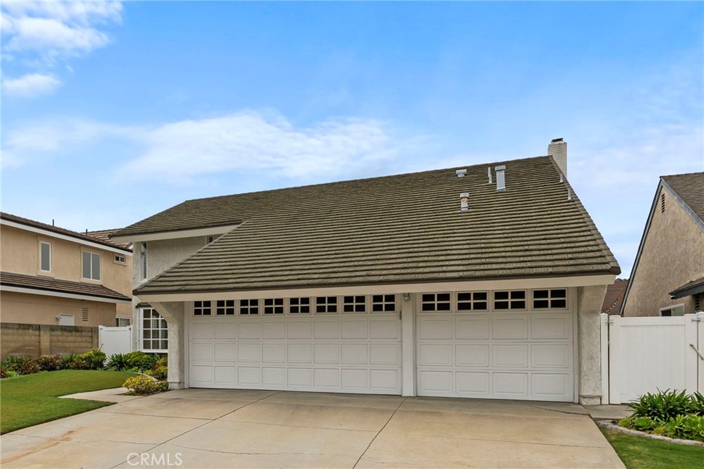 2342 Caper Tree Drive Tustin, CA 92780 - Photo 42 of 44 a black and white building with a outdoor space