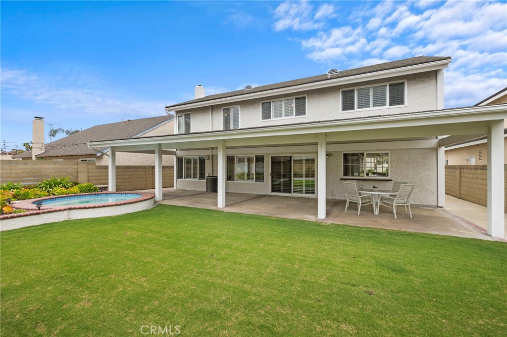 2342 Caper Tree Drive Tustin, CA 92780 - Photo 6 of 44 front view of a house with a swimming pool