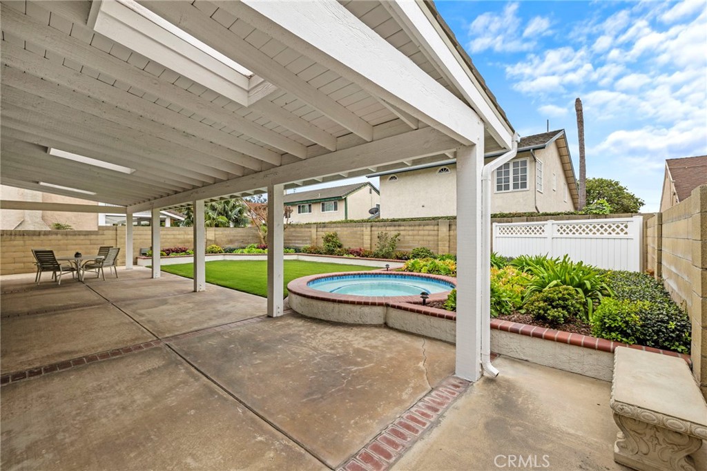 2342 Caper Tree Drive Tustin, CA 92780 - Photo 8 of 44 a view of a patio with table and chairs