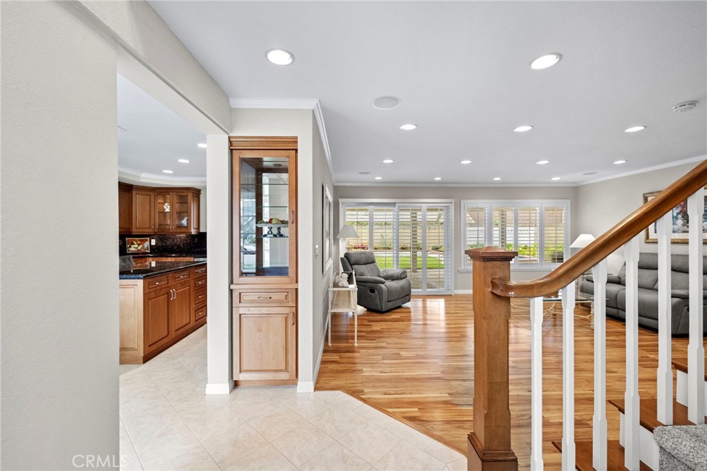 2342 Caper Tree Drive Tustin, CA 92780 - Photo 9 of 44 a view of a hallway with dining area and chandelier
