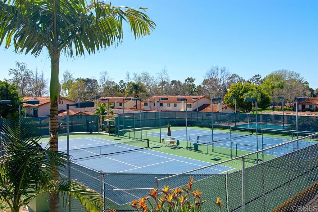 6868 Pear Tree Drive Carlsbad, CA 92011 - Photo 35 of 40 a tennis court with view of palm trees