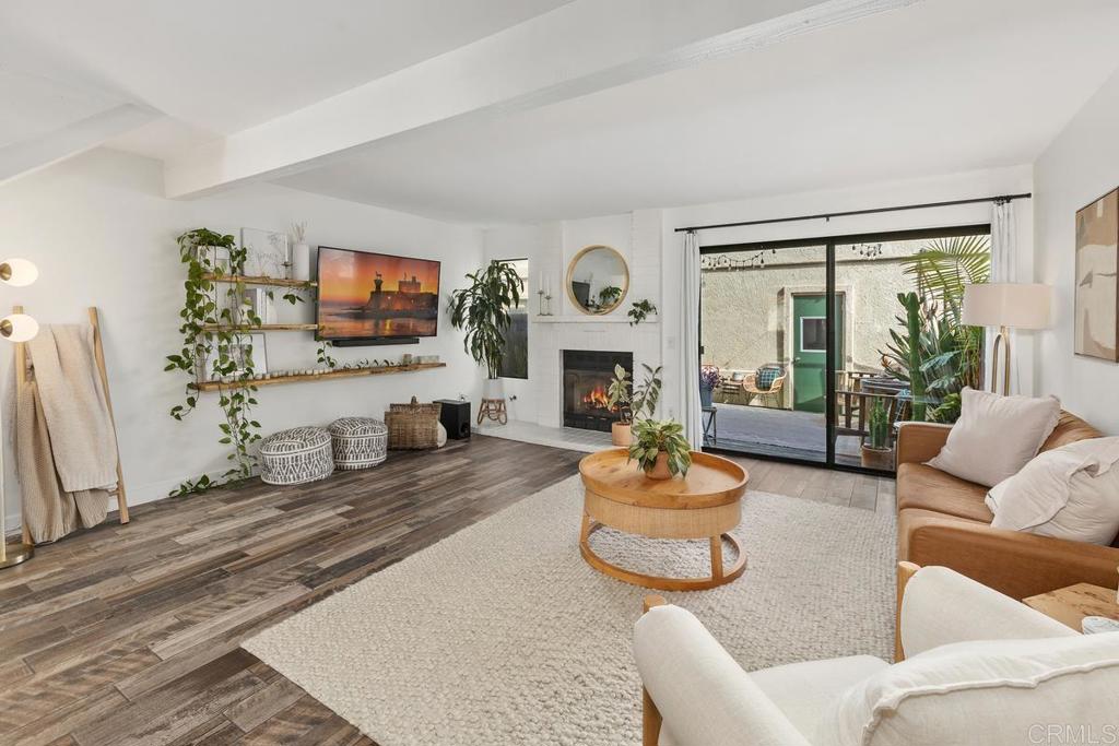 6868 Pear Tree Drive Carlsbad, CA 92011 - Photo 7 of 40 a living room with fireplace furniture and a flat screen tv