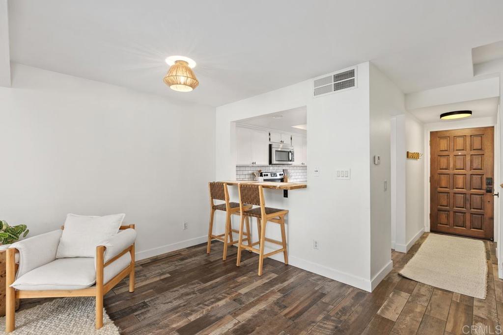 6868 Pear Tree Drive Carlsbad, CA 92011 - Photo 9 of 40 a living room with furniture and a table
