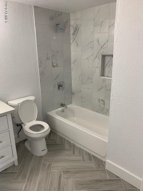 1706 West Colt Road Chandler, AZ 85224 - Photo 11 of 35 a bathroom with a toilet and a shower