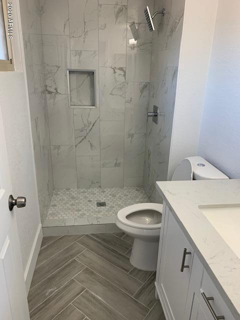 1706 West Colt Road Chandler, AZ 85224 - Photo 14 of 35 a bathroom with a sink a toilet and shower