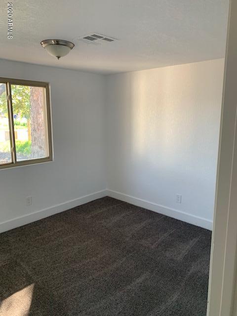 1706 West Colt Road Chandler, AZ 85224 - Photo 18 of 35 an empty room with a window