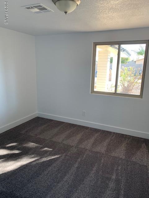 1706 West Colt Road Chandler, AZ 85224 - Photo 20 of 35 an empty room with a window
