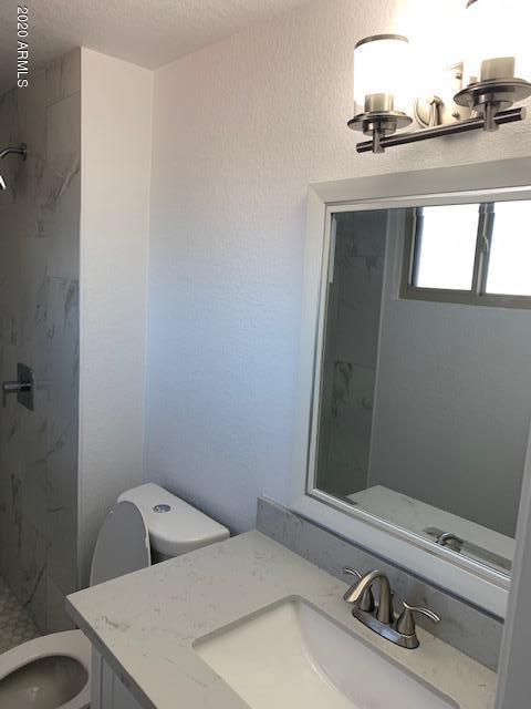 1706 West Colt Road Chandler, AZ 85224 - Photo 22 of 35 a bathroom with a sink and a toilet