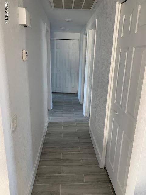 1706 West Colt Road Chandler, AZ 85224 - Photo 25 of 35 a view of a hallway with wooden floor