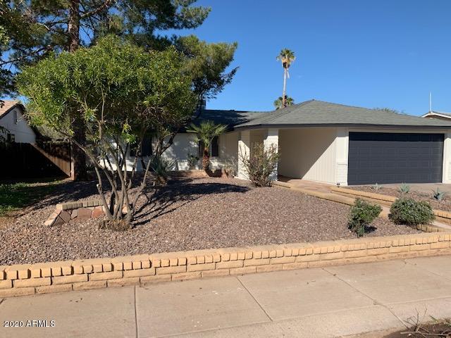 1706 West Colt Road Chandler, AZ 85224 - Photo 27 of 35 a view of a house with a yard